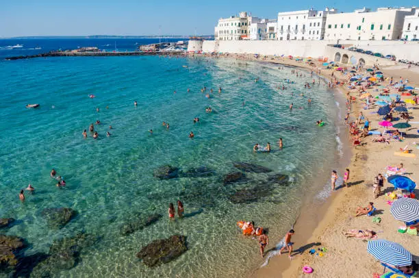 Beach of Purity, Gallipoli, Puglia, Italy - 4 August 2013: A beach at the tip of the peninsula with Gallipoli's old town.