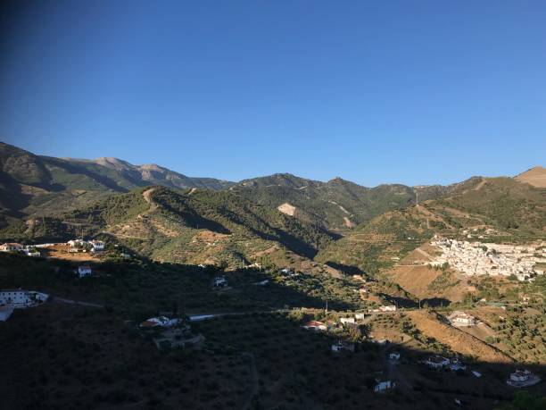 istock Clear blue sky over mountains and a view looking over spanish villages 1175931585