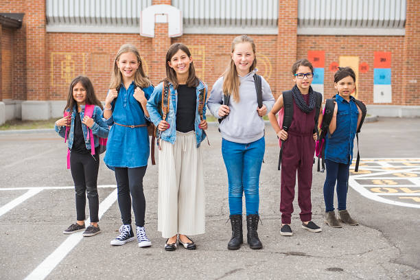 istock group of kids on the school background having fun 1175934412