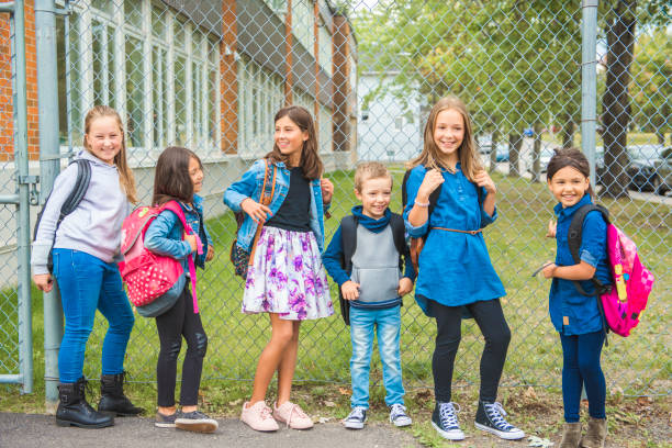 istock Some nice kids on the school background having fun 1175934447