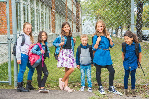 istock Some nice kids on the school background having fun 1175934479