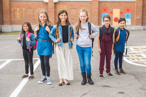 istock group of kids on the school background having fun 1175934527