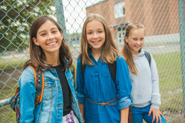 istock Some nice kids on the school background having fun 1175934528
