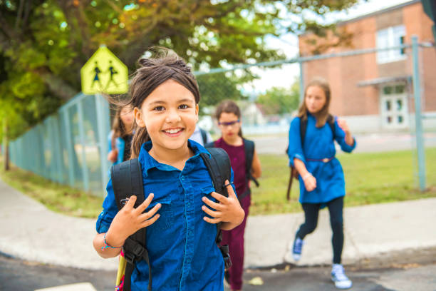 istock Some nice kids on the school background having fun 1175934553