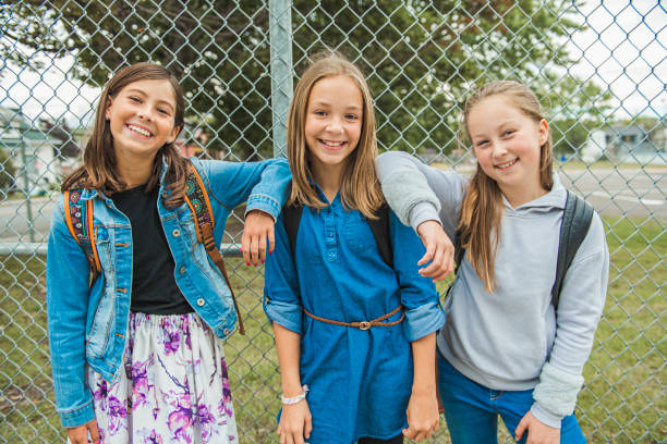 istock Some nice kids on the school background having fun 1175934587
