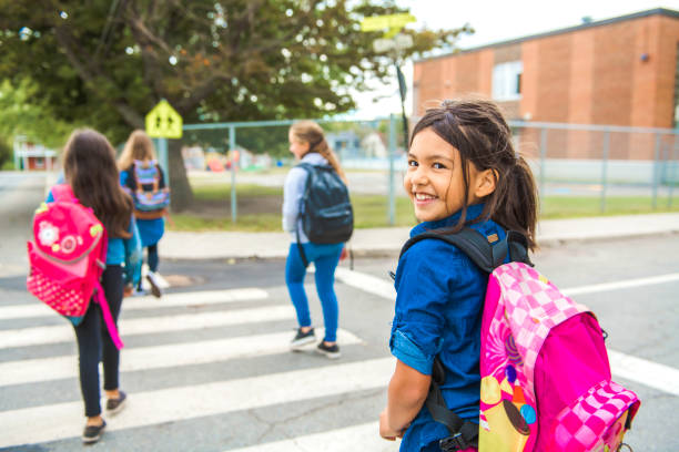 istock Some nice kids on the school background having fun 1175934594