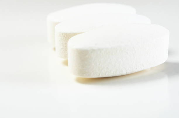 istock White pills spill out white bottle 1175935343