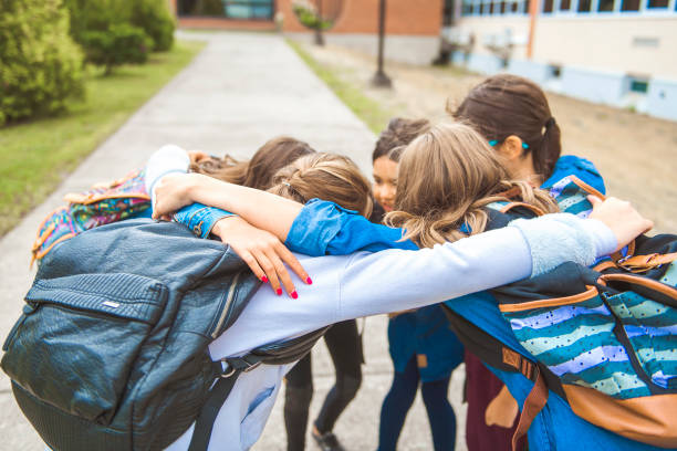 istock Some nice kids on the school background having fun 1175935360