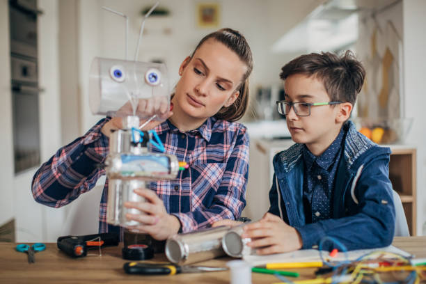 istock Boy and sister making toy 1175935938