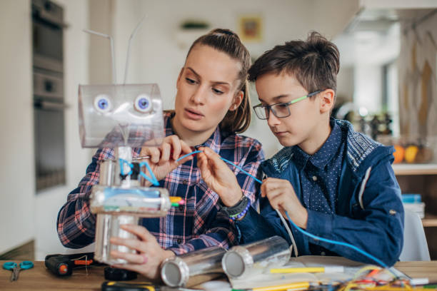 istock Boy and sister making toy 1175936056