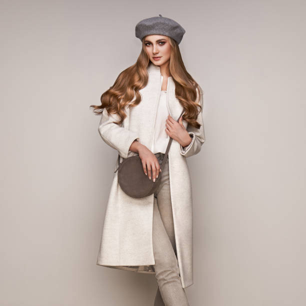 istock Young woman in white autumn coat 1175936113
