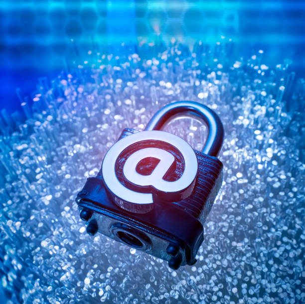 istock Email signs on lock with Fiber optics background 1175939383