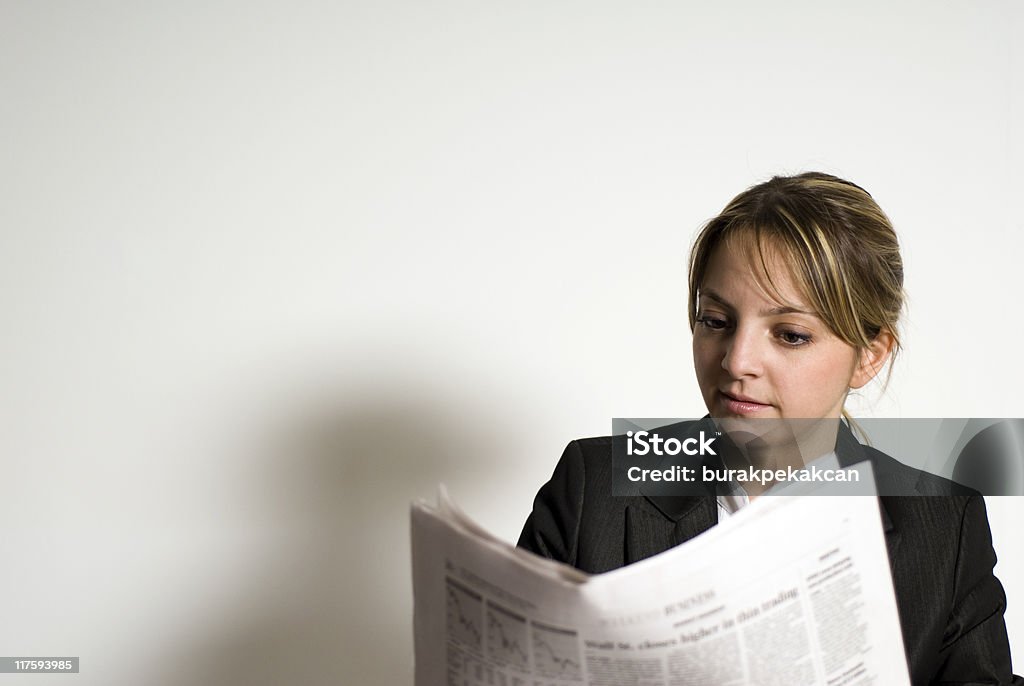 Businesswoman reading a newspaper  Reading Stock Photo