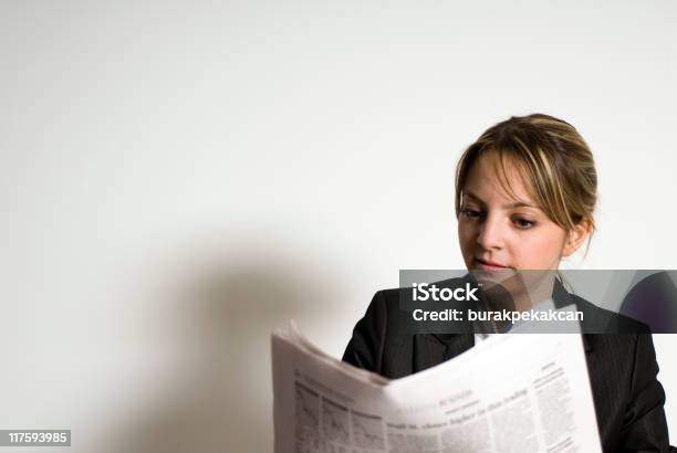 Businesswoman Reading A Newspaper Stock Photo - Download Image Now - Reading, Front View, Newspaper