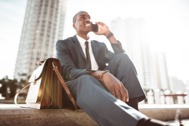 istock businessman make a phone call in miami 1175940082