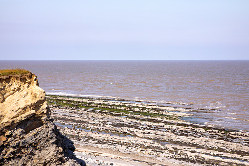Scenic english beach landscape with cliff. Interesting Rock formations beach. Jurassic rock forms on beach. Famous place.