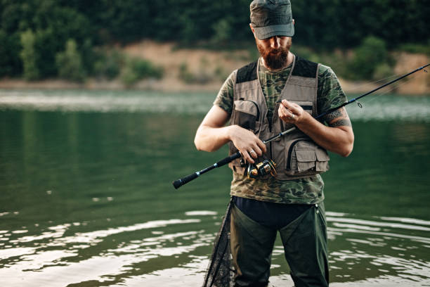 istock Man fishing in the river 1175943676
