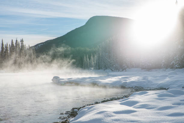 istock Foggy river and snowy landscape in Canada, Winter 1175944053