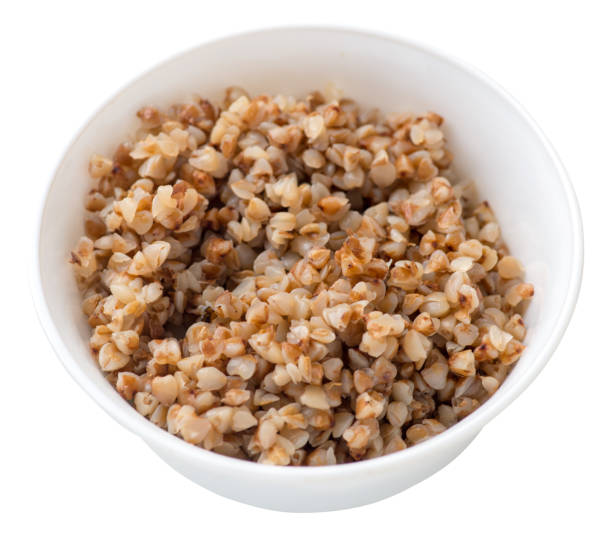 istock buckwheat in a plate isolated on white background. buckwheat top view. 1175945171