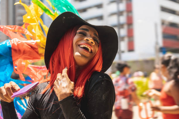 Afro Drag queen laughing out loud at the outdoor LGBT parade Portrait, LGBTQI Pride Event, Afro, Pride, Laughing crossdressing stock pictures, royalty-free photos & images