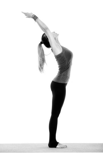 istock Woman stretching on yoga mat 1175948725