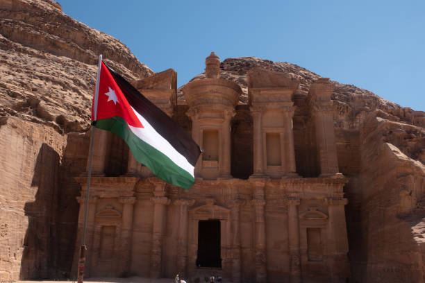 istock The Jordan flag in  Petra' 1175951054