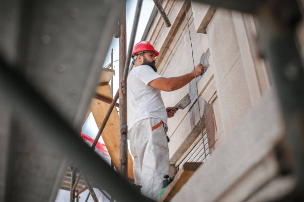 istock Man worker standing on scaffolding and restore old building facade 1175951653