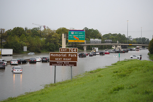 Houston, Texas / USA - September 19 2019: Tropical Storm Imelda causes closure of Interstate 10 in Houston, Texas due to high water. Many cars are seen stranded on Interstate 10 in Houston, Texas due to flooding caused by the remains of Tropical Storm Imelda.