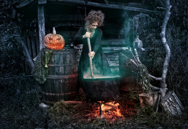 istock Old witch in her barn brewing potions 1175951799