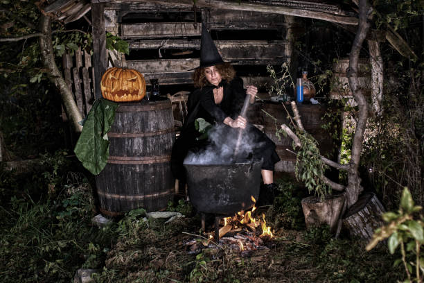 istock Old witch in her barn brewing potions 1175951834