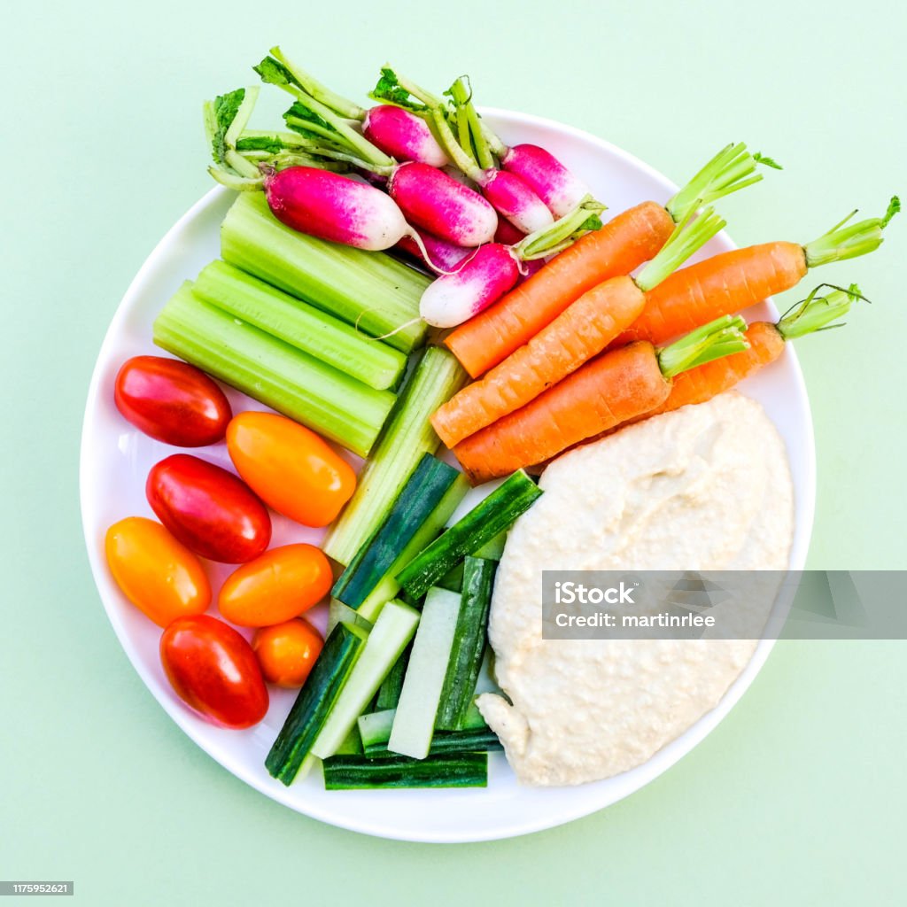 Fresh Vegetable Crudite Platter With Hummus Fresh Vegetable Crudite Platter With Hummus and Baby Carrots, Radishes, Cucumber, Celery and Tomatoes Crudite Stock Photo