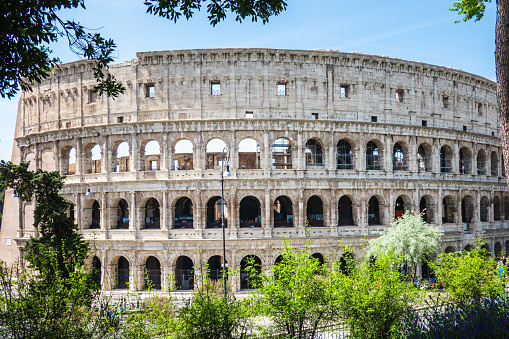 Rome, Italy- April 24, 2019: Great Roman Colosseum (Coliseum, Colosseo) also known as the Flavian Amphitheatre. Famous world landmark. Scenic urban landscape