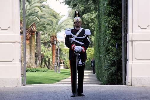 Quirinal Palace guard at the side gate to the garden, Rome, Italy