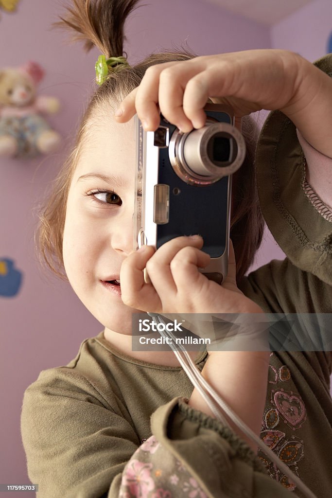 Baby with digital camera Aperture Stock Photo