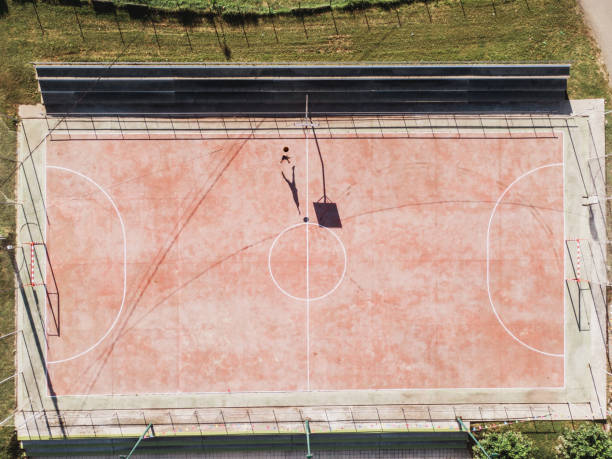 istock Person playing basketball alone as seen from above 1175961769