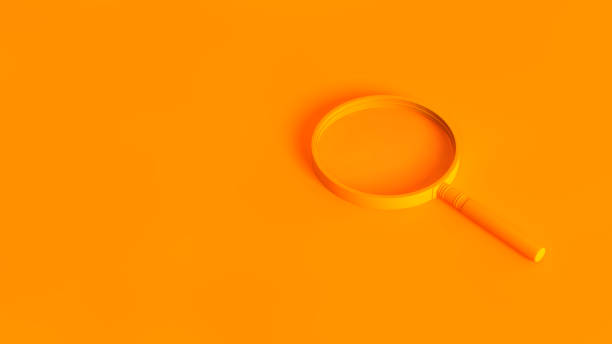 Magnifying glass isolated on orange background. Conceptual image of analysis, search, explore, analytics.