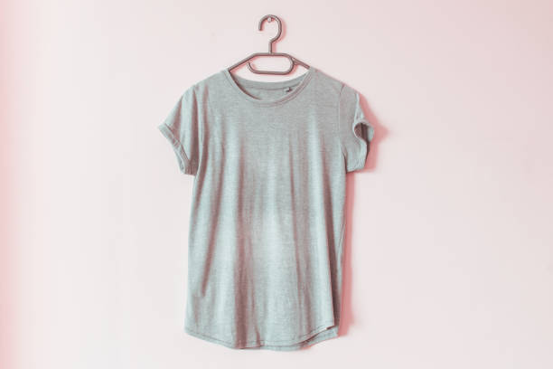 istock Folded casual t shirt mockup template hanging on a rack 1175962937