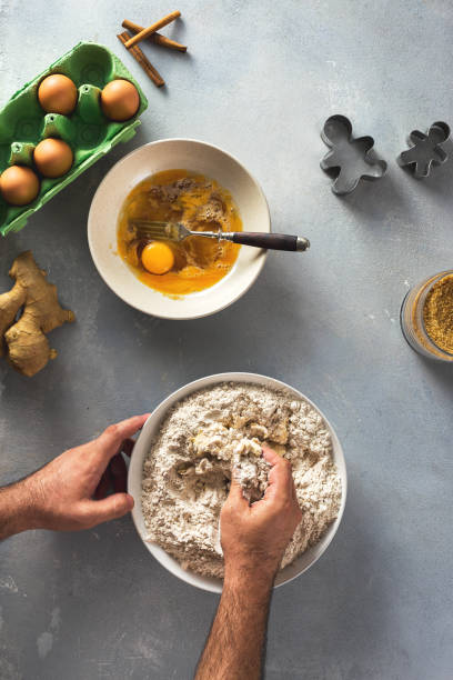 istock Man cooking christmas gingerbread cookies 1175963187