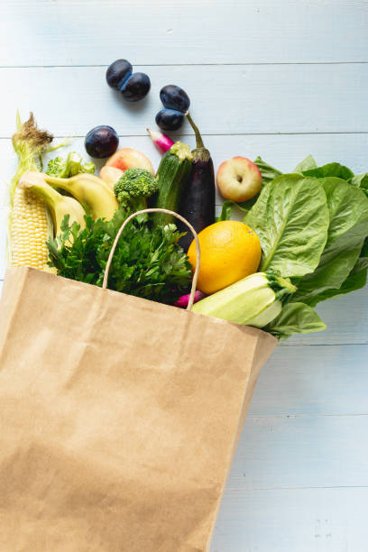 istock Grocery bag with vegetables and fruits 1175963283
