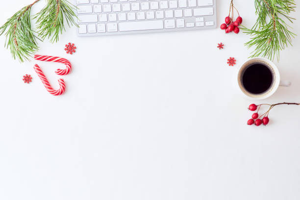 istock Flat lay christmas home office desk with pine branches and keyboard, christmas decorations  on a white background 1175965296