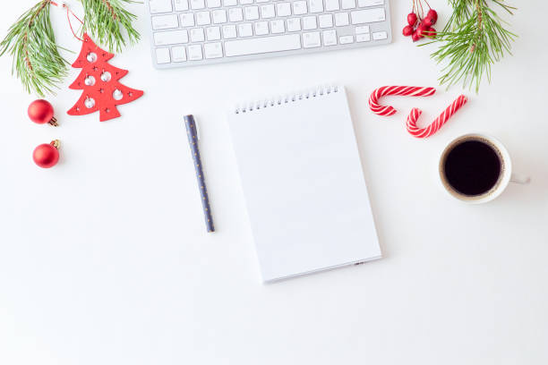 istock Mockup white notebook with pine branches and keyboard, christmas decorations  on a white background 1175965302