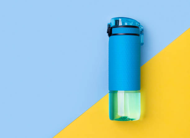 istock Blue bottle of water. Sport beverage on creative background. 1175965735