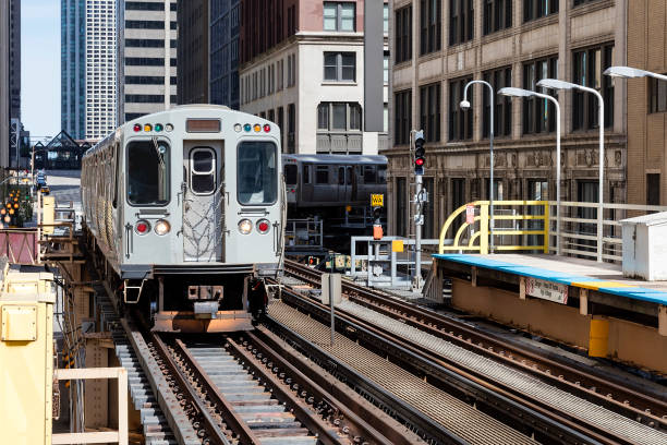 istock Subway Train Approaching  Elevated Subway Station in Chicago, Illinois 1175966307