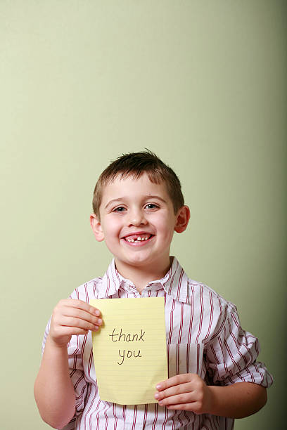 istock Boy with a Message of Gratitude 117596764