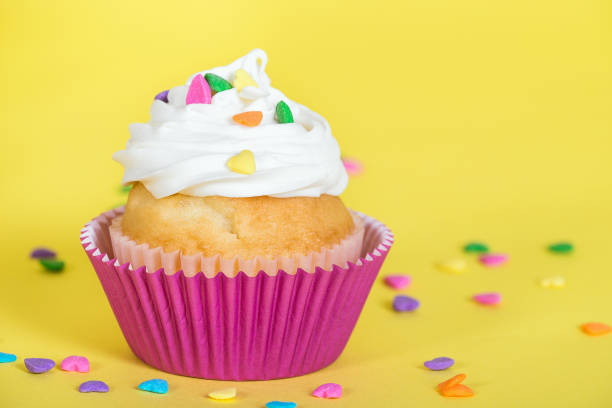 istock Colorful cupcake decorated with heart shaped sprinkles 1175968004
