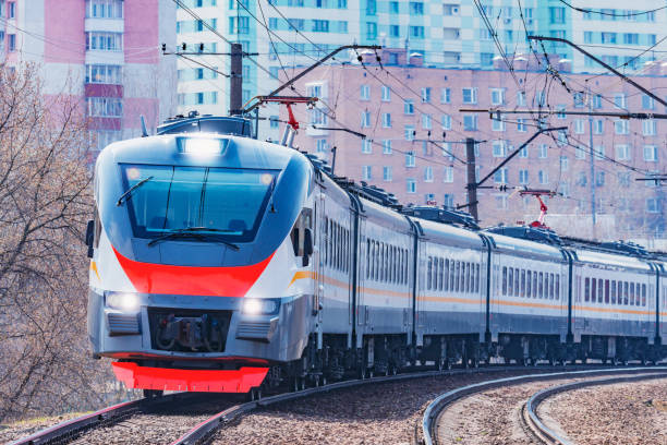 istock Modern high-speed train moves on the city background. 1175968226