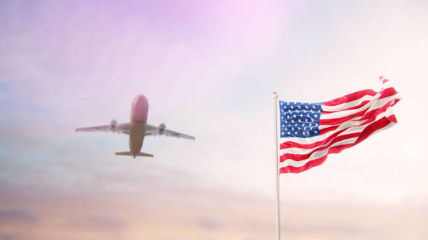 istock USA Flag With Airplane At Background 1175974234