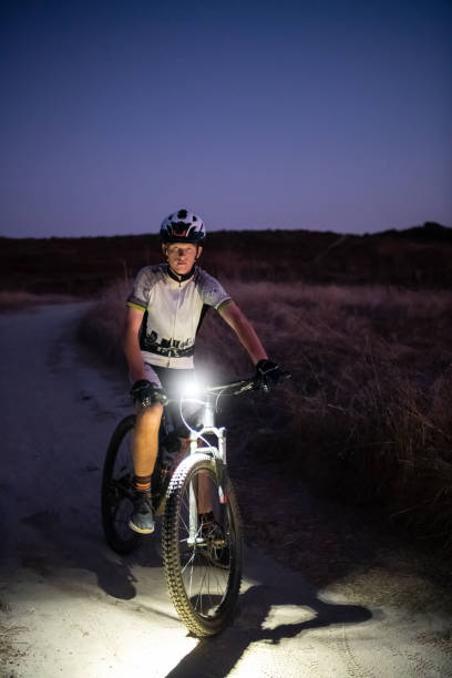istock Night MTB Rider With A Light At Sunset 1175974492