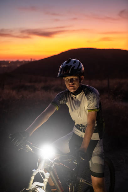 istock Night MTB Rider With A Light At Sunset 1175974507