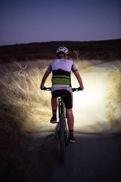 istock Night MTB Rider With A Light At Sunset 1175975043
